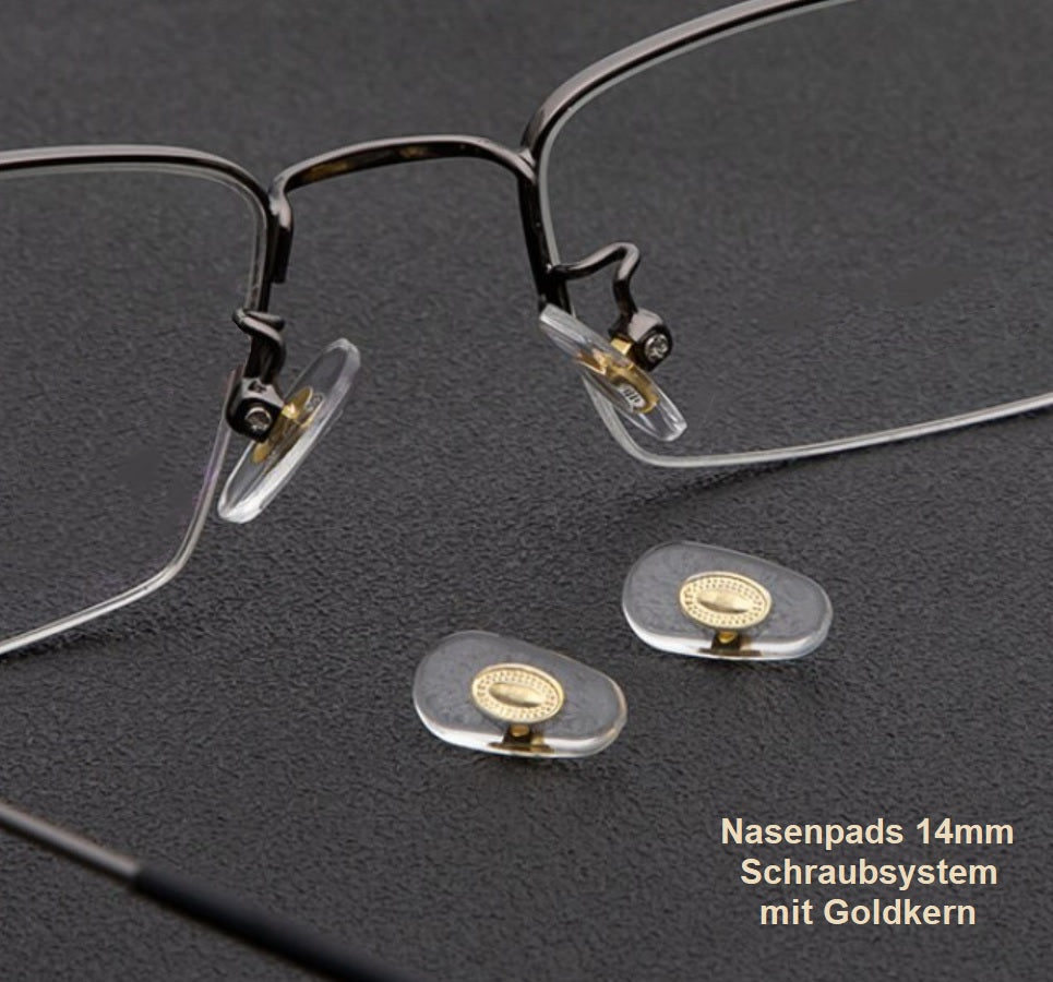 nasenpads auf Brille mit Goldkern auf grauen hintergrund